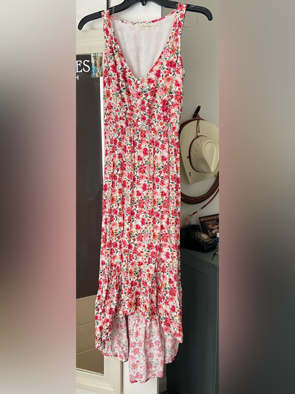 Floral Sleeveless V-Neck Maxi Dress in white with shades of pink flowers .